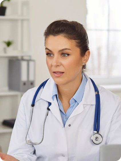 Board certified physician with stethoscope providing in-person medical evaluation in Orlando clinic
