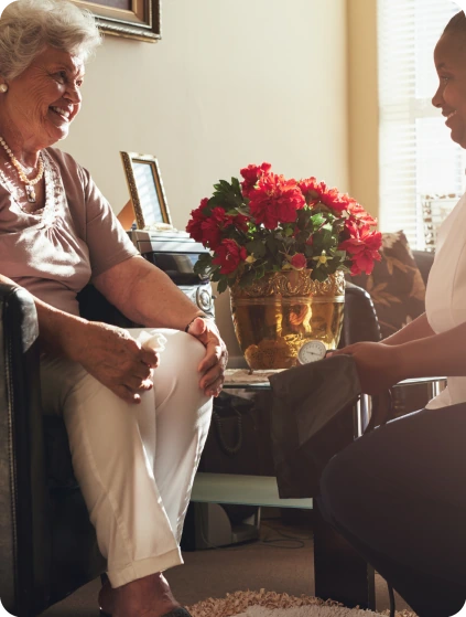 Visiting concierge physician evaluating patient bedside in hotel room in Orlando